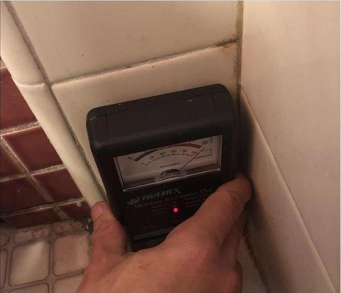 moisture meter on tile