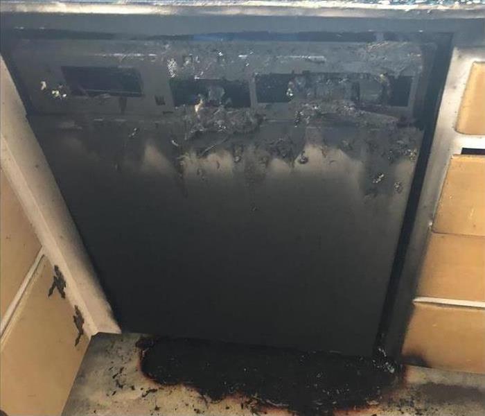 dishwasher covered in soot