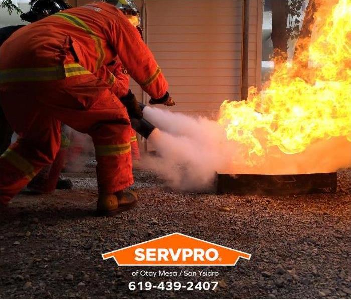 A firefighter extinguishes a fire. 