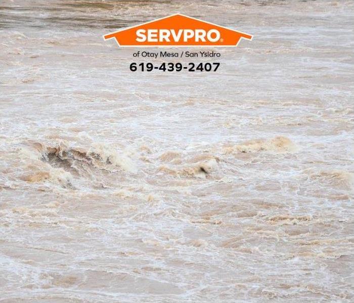 Storm floodwaters cover a street.