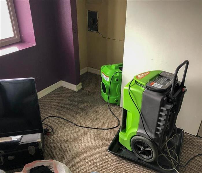 SERVPRO drying equipment in the bedroom of a San Ysidro home that experienced water damage