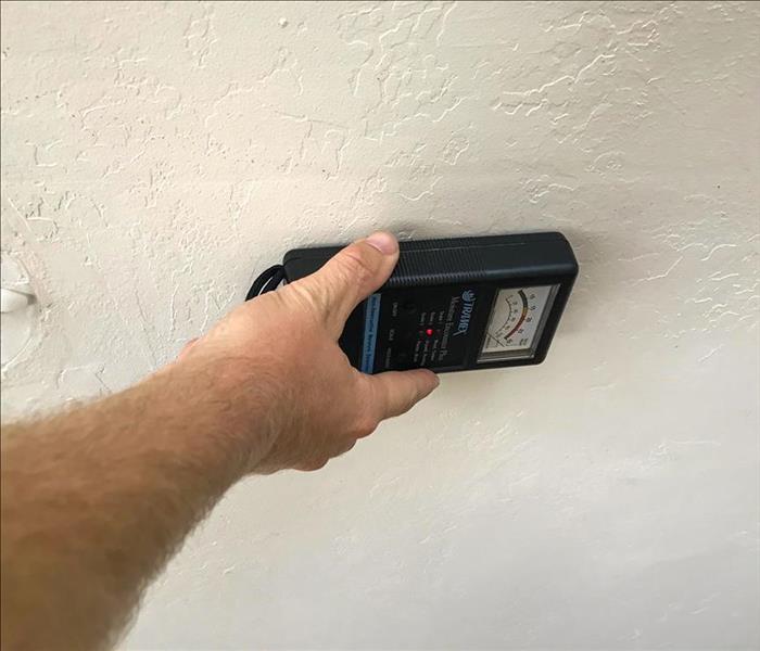 moisture meter on a ceiling