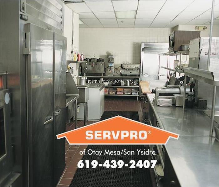 A large commercial kitchen of a restaurant is clean and ready for business. 