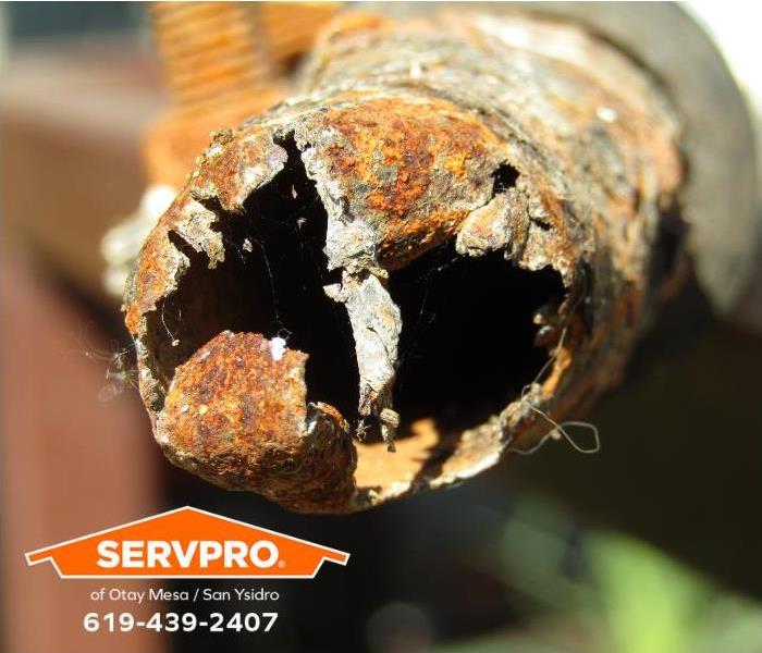 An old, corroded pipe is shown.