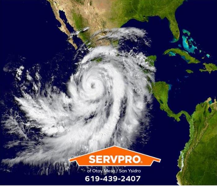 A hurricane is traveling up the coast toward Baja California.